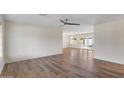 Bright living room showcasing beautiful wood-look floors and lots of natural light from large windows at 7254 E Vernon Ave, Scottsdale, AZ 85257