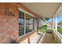 View of front porch and manicured shrubs, with the house number 7254 clearly displayed at 7254 E Vernon Ave, Scottsdale, AZ 85257
