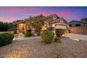Attractive home showcasing desert landscaping, stone accents, and a welcoming entrance at 7471 E Desert Vista Rd, Scottsdale, AZ 85255