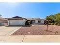 Charming single-story home featuring a two-car garage and low-maintenance landscaping at 1311 W Palo Verde Dr, Chandler, AZ 85224