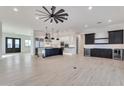 Spacious open-concept living area with modern floors, stainless steel appliances, and wine bar at 1602 E Cloud Rd, Phoenix, AZ 85086