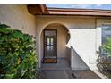 Inviting entryway with an arched doorway, a 'Welcome' mat, and a glimpse of the home's interior at 20602 N 31St Dr, Phoenix, AZ 85027