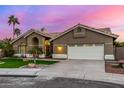 Inviting single-story home featuring a tile roof, desert landscaping, and a two-car garage at 21 W Pecan Pl, Tempe, AZ 85284