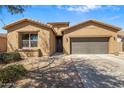 Welcoming single story home with low maintenance desert landscaping and an attached two-car garage at 2524 E Katrina Trl, Casa Grande, AZ 85194