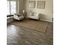 Cozy living room with a neutral rug, large window and plenty of comfortable seating at 2634 E Fountain St, Mesa, AZ 85213