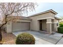 Inviting home featuring a two-car garage and a charming, well-maintained yard at 2753 S 85Th Way, Mesa, AZ 85209