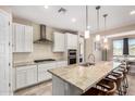 Bright kitchen featuring granite countertops, stainless steel appliances and eat-in breakfast bar at 2753 S 85Th Way, Mesa, AZ 85209