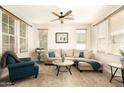 Bright living room with plush seating, a ceiling fan, and plenty of natural light at 2918 N 48Th Pl, Phoenix, AZ 85018