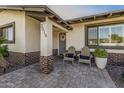 Cozy front porch with comfortable seating and brick accents at 3016 N 49Th St, Phoenix, AZ 85018