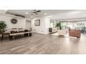 Bright, open-concept living room with a dining table and seamless access to the outdoor pool area at 3016 N 49Th St, Phoenix, AZ 85018
