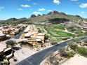 Aerial view of the Tuscan community with a golf course and mountain views at 5370 S Desert Dawn Dr # 50, Gold Canyon, AZ 85118