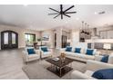 Open-concept living room showcases stylish furniture, contemporary lighting, and seamless flow into the kitchen at 544 E Amber Sun Dr, Phoenix, AZ 85086