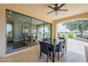 Covered patio offers seamless indoor/outdoor living with views of the golf course and water feature at 623 E Peach Tree St, Queen Creek, AZ 85140
