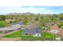 Expansive aerial view showcasing the home's backyard, neighborhood, and scenic mountain backdrop at 7801 N 4Th Pl, Phoenix, AZ 85020
