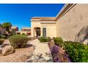 Beautiful front entrance with desert landscaping and a winding sidewalk at 8850 W Piute Ave, Peoria, AZ 85382