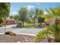 Picturesque neighborhood showcasing lush green spaces and beautiful desert landscaping at 12708 W Auburn Dr, Peoria, AZ 85383