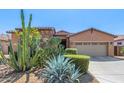 Charming home featuring desert landscaping, rock accents, and a two-car garage at 17743 W Verdin Rd, Goodyear, AZ 85338