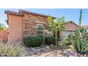 This property features desert landscaping and rock accents in the front yard at 17743 W Verdin Rd, Goodyear, AZ 85338