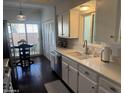 A kitchen with stainless steel appliances and white cabinetry at 2905 E Montecito Ave, Phoenix, AZ 85016