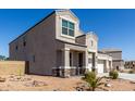 Attractive two-story home with desert landscaping and a spacious three-car garage at 3932 N 306Th Ln, Buckeye, AZ 85396