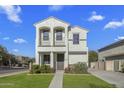 Inviting two-story home featuring stucco exterior, small balconies, and a neatly landscaped front yard at 4132 E Santa Fe Ln, Gilbert, AZ 85297