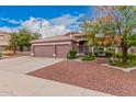 Inviting single-level home with a well-maintained front yard and a three-car garage at 5031 W Ivanhoe St, Chandler, AZ 85226