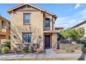 Inviting two-story home with a well-manicured lawn, stucco siding and a covered front porch at 857 S Osborn Ln, Gilbert, AZ 85296