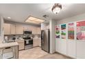 Bright kitchen features stainless steel appliances and ample cabinet space at 10410 N Cave Creek Rd # 1078, Phoenix, AZ 85020