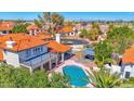 Aerial view of a house with a pool, gazebo, and well-maintained yard in a neighborhood setting at 12407 N 54Th Ave, Glendale, AZ 85304