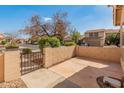 Private walled patio offers a cozy outdoor space with a view of the neighborhood at 13828 S 42Nd St, Phoenix, AZ 85044