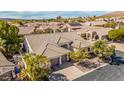 Expansive aerial view showcases the tile roof of this desert home in a well-landscaped community at 14244 N 14Th Pl, Phoenix, AZ 85022