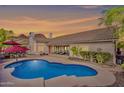 Gorgeous backyard featuring a refreshing pool, desert landscaping, and sunset views at 14244 N 14Th Pl, Phoenix, AZ 85022