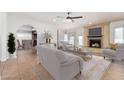 Inviting living room showcases a fireplace and views of the kitchen and dining areas at 1614 W Beaubien Dr, Phoenix, AZ 85027