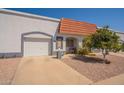 Charming single-story home with a well-manicured front yard and attached one car garage at 1951 N 64Th St # 26, Mesa, AZ 85205