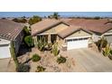 Well-maintained home with desert landscaping, two-car garage, and tile roof at 202 W Twin Peaks Pkwy, San Tan Valley, AZ 85143