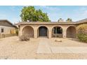 Charming arched brick entryway to the house and well-maintained desert landscaping at 2110 E Laguna Dr, Tempe, AZ 85282