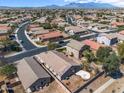 Neighborhood aerial shot highlighting single Gathering homes with desert landscaping and mountain views at 21867 N Kirkland Dr, Maricopa, AZ 85138