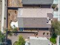 Aerial view of a single-story home showcasing the roof and landscaping in the backyard at 21867 N Kirkland Dr, Maricopa, AZ 85138