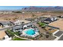 Community pool with lounge chairs and view of the mountains and desert landscape at 2650 E Dutchmans Trl, Apache Junction, AZ 85119