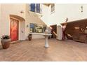 Charming courtyard with tiled flooring, fountain, and outdoor lounge, creating a serene and inviting space at 2830 E Janelle Way, Gilbert, AZ 85298