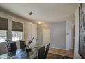 Inviting dining area with a glass-top table, modern chairs, and neutral decor at 3102 W T Ryan Ln, Phoenix, AZ 85041