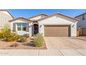 Charming single-story home showcasing desert landscaping and a paved driveway at 40160 W Hensley Way, Maricopa, AZ 85138