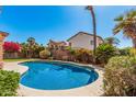 Refreshing private pool surrounded by mature landscaping, ideal for relaxation and outdoor entertaining at 4931 E Paradise Ln, Scottsdale, AZ 85254