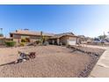 Single-story home featuring desert landscaping and a two-car garage at 5434 W Golden Ln, Glendale, AZ 85302