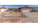 Charming single-story home with desert landscaping and a two-car garage at 5434 W Golden Ln, Glendale, AZ 85302