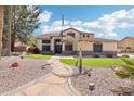 Charming two-story home with well manicured lawn and desert landscaping at 5613 W West Wind Dr, Glendale, AZ 85310