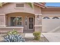 Welcoming front entrance with decorative security door and desert flora at 11725 W Jefferson St, Avondale, AZ 85323