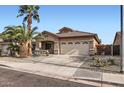 Inviting single-level home showcasing a two-car garage and tidy desert landscaping at 11725 W Jefferson St, Avondale, AZ 85323