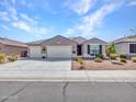 Beautiful single-story home with a spacious three-car garage and charming curb appeal at 13451 W Remuda Dr, Peoria, AZ 85383