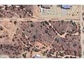 Aerial view of a desert property showcasing land and surrounding neighborhood streets at 15519 E Windstone Trl, Rio Verde, AZ 85263